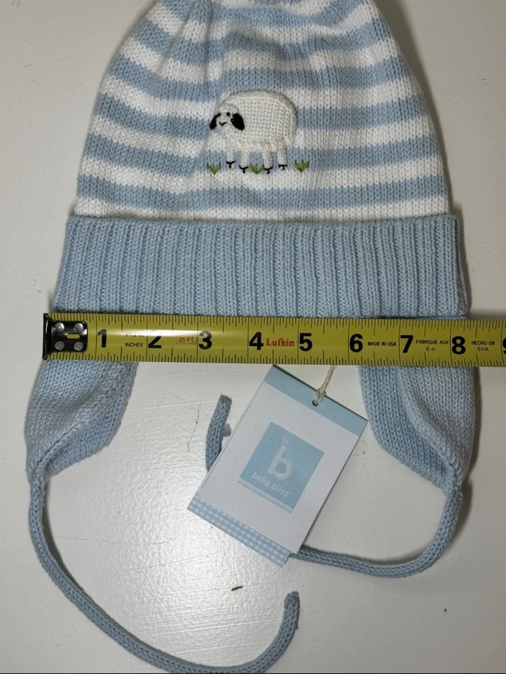 NWT Bella Bliss blue and white cotton child’s hat with ear flaps and ties.